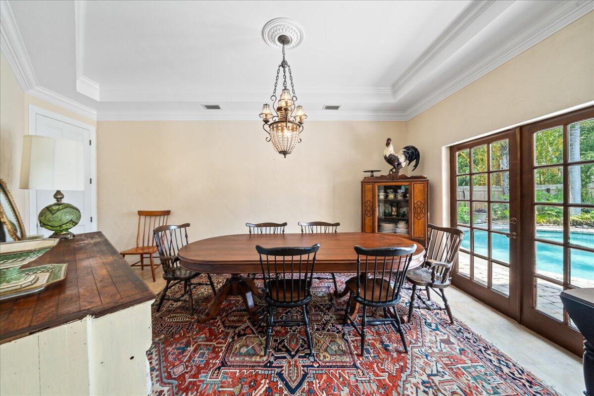 1244 Cimarron Circle Northeast Palm Bay, FL 32905 - Photo 13 of 38 a view of a dining room with furniture window and wooden floor