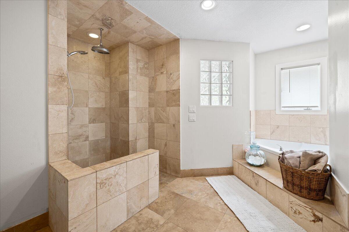1244 Cimarron Circle Northeast Palm Bay, FL 32905 - Photo 19 of 38 a bathroom with a tub sink and mirror