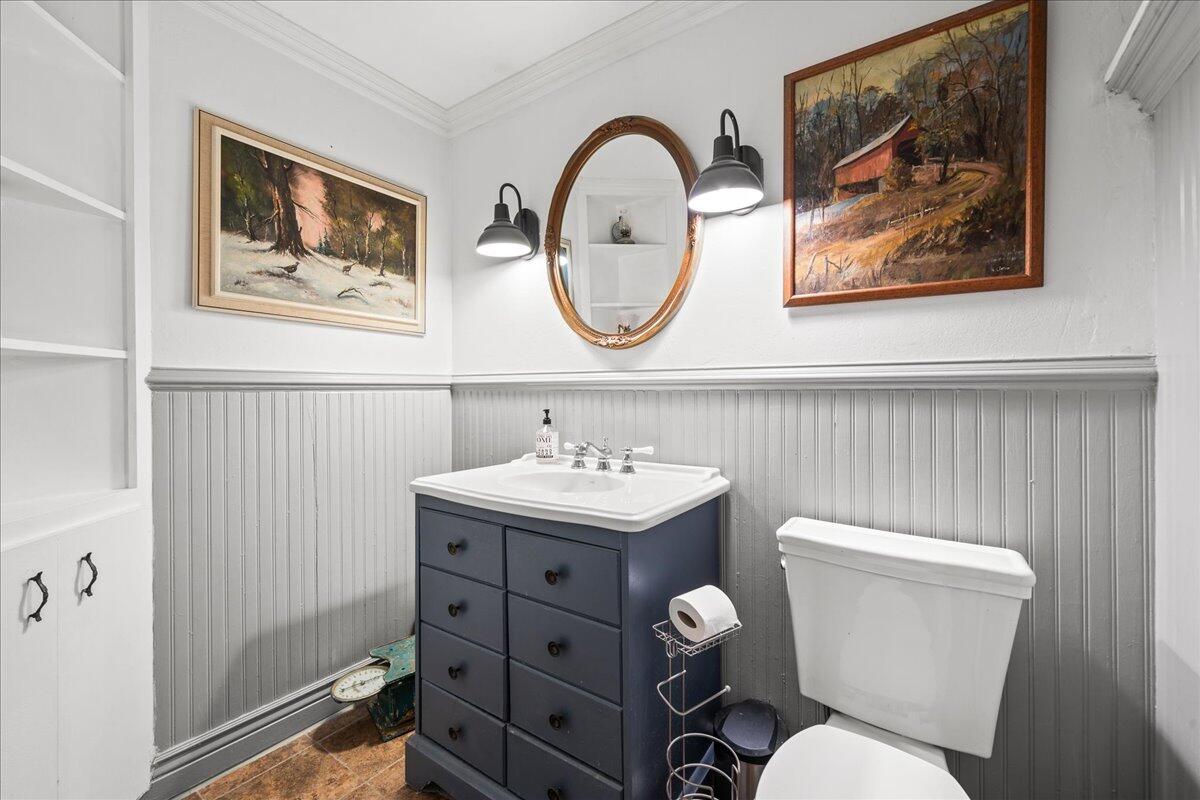 1244 Cimarron Circle Northeast Palm Bay, FL 32905 - Photo 21 of 38 a bathroom with a toilet a sink and a mirror