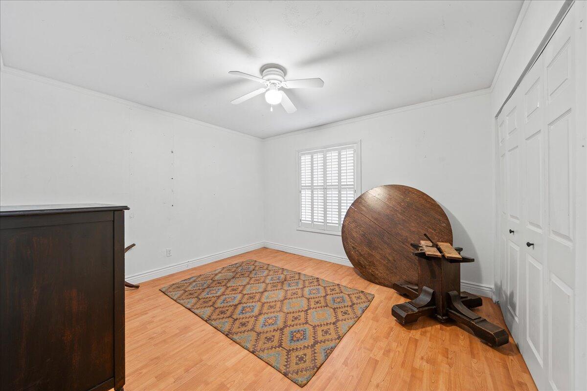 1244 Cimarron Circle Northeast Palm Bay, FL 32905 - Photo 26 of 38 a view of workspace with wooden floor and workspace