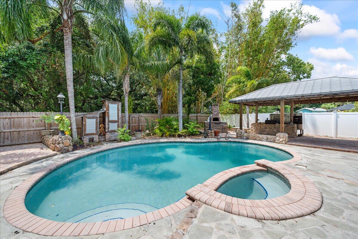 1244 Cimarron Circle Northeast Palm Bay, FL 32905 - Photo 28 of 38 a view of swimming pool having outdoor seating