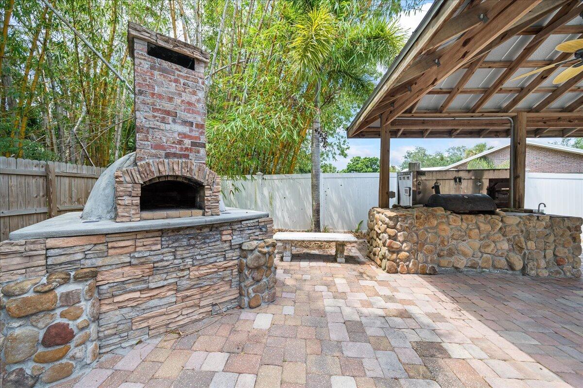 1244 Cimarron Circle Northeast Palm Bay, FL 32905 - Photo 32 of 38 a view of house with outdoor space