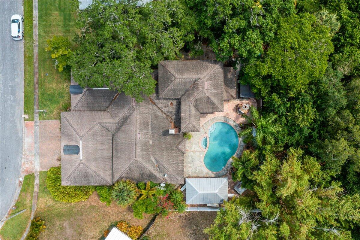 1244 Cimarron Circle Northeast Palm Bay, FL 32905 - Photo 38 of 38 an aerial view of a house with a garden