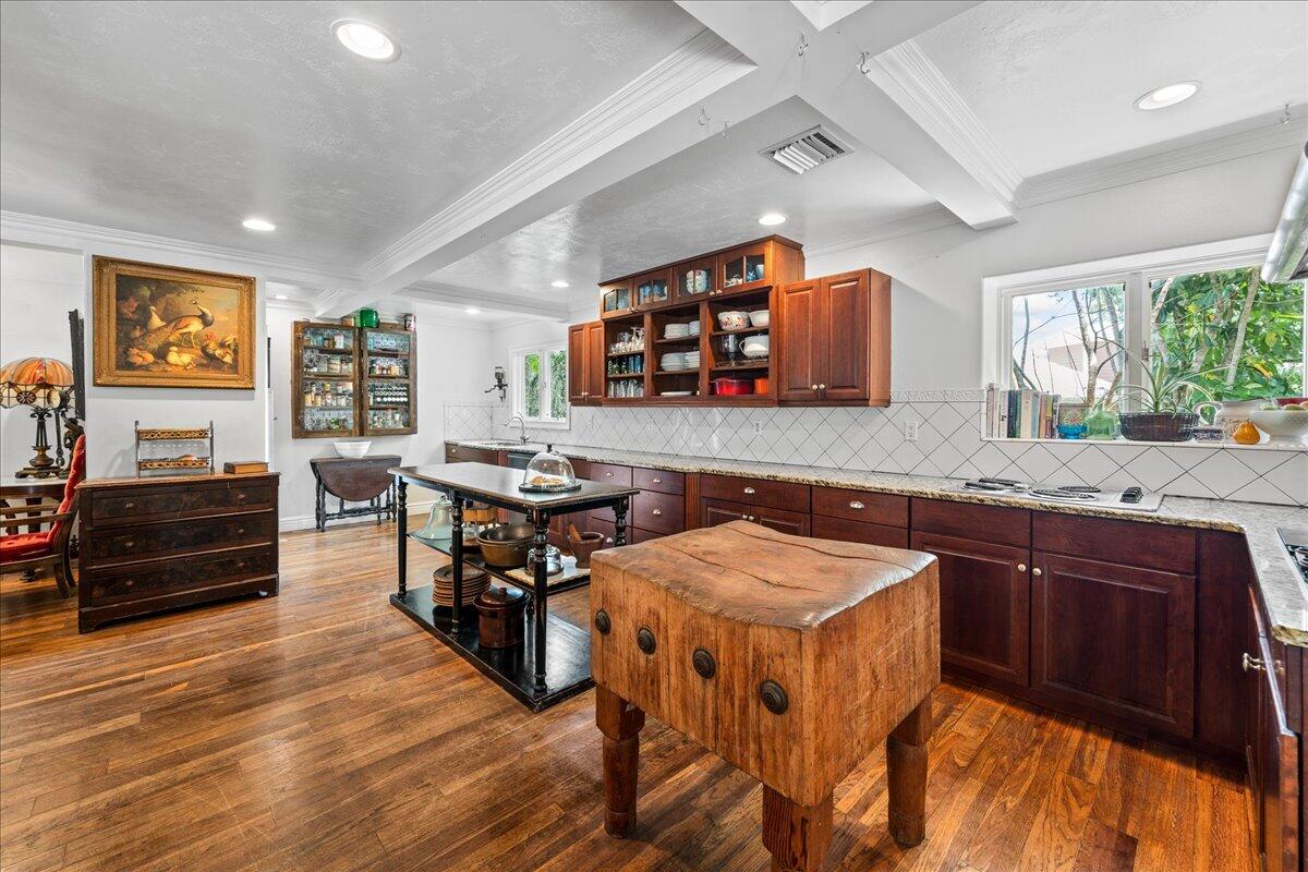1244 Cimarron Circle Northeast Palm Bay, FL 32905 - Photo 7 of 38 a kitchen with stainless steel appliances granite countertop a stove and a refrigerator