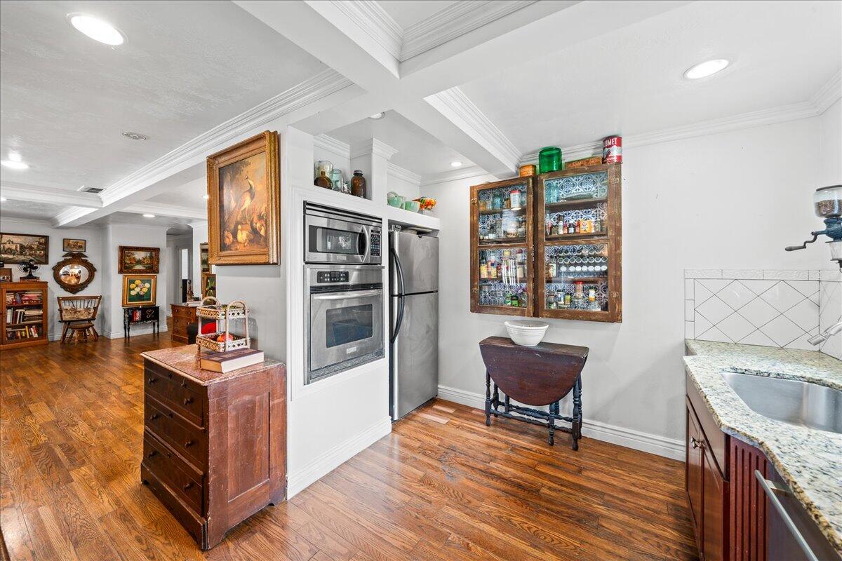 1244 Cimarron Circle Northeast Palm Bay, FL 32905 - Photo 9 of 38 a living room with furniture and a wooden floor