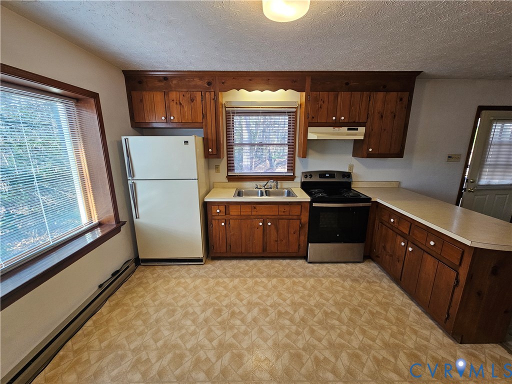 7866 Wilton Road, Unit 1 Henrico, VA 23231 - Photo 13 of 22 a kitchen with a refrigerator and a sink