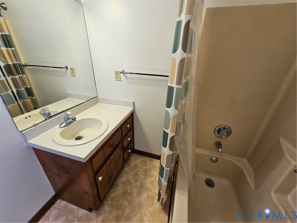 7866 Wilton Road, Unit 1 Henrico, VA 23231 - Photo 19 of 22 a bathroom with a sink toilet and shower