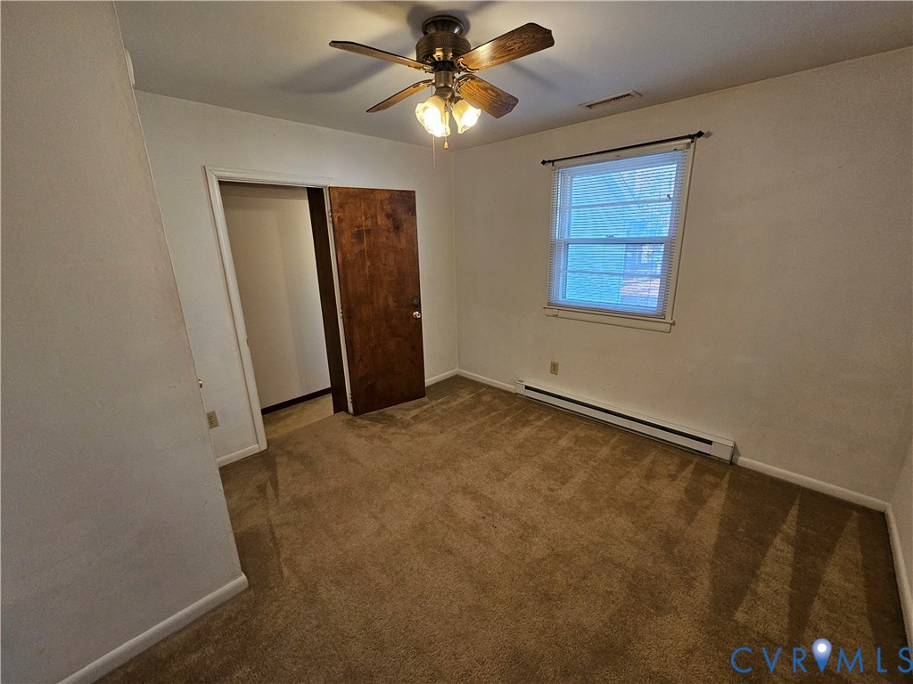 7866 Wilton Road, Unit 1 Henrico, VA 23231 - Photo 22 of 22 an empty room with windows and fan