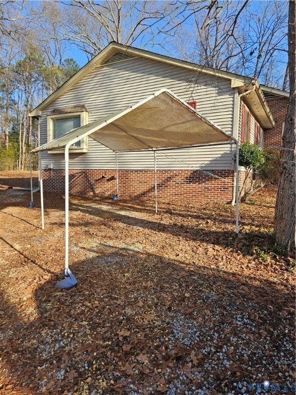 7866 Wilton Road, Unit 1 Henrico, VA 23231 - Photo 8 of 22 a view of a house with a backyard