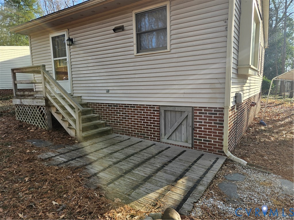 7866 Wilton Road, Unit 1 Henrico, VA 23231 - Photo 10 of 22 a view of a house with a door and wooden floor