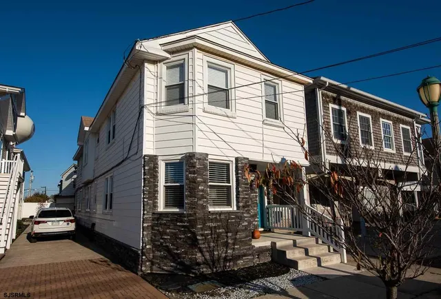 a view of a house with a street