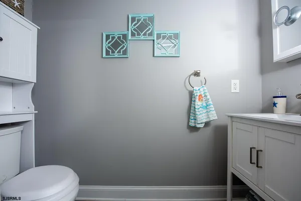 a bathroom with a toilet and a sink