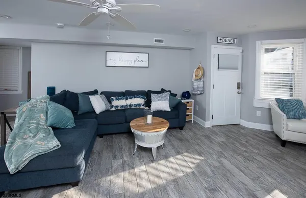 a living room with furniture and a chair