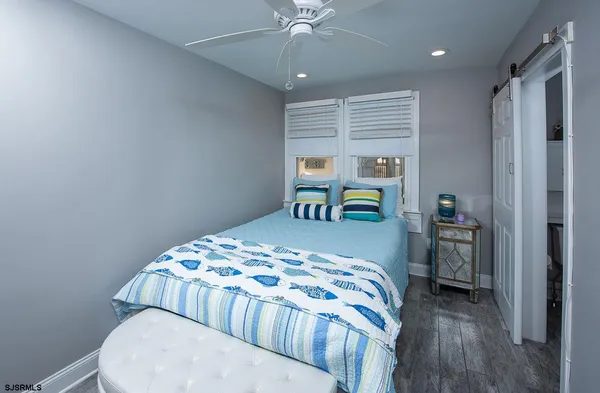 a bedroom with a bed and a table in it