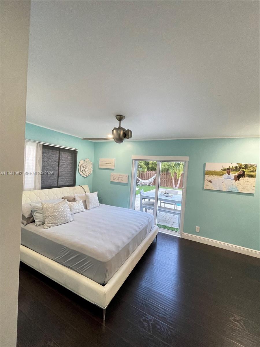 6901 Northwest 82nd Court Tamarac, FL 33321 - Photo 5 of 13 a bedroom with a bed and window
