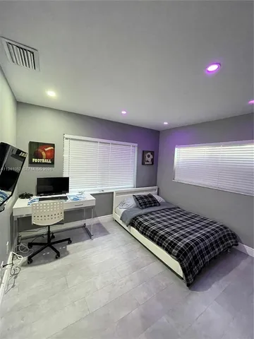 a living room with furniture rug and a window