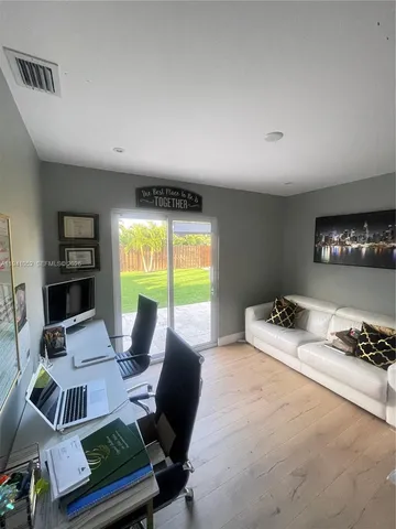 a living room with furniture and a window