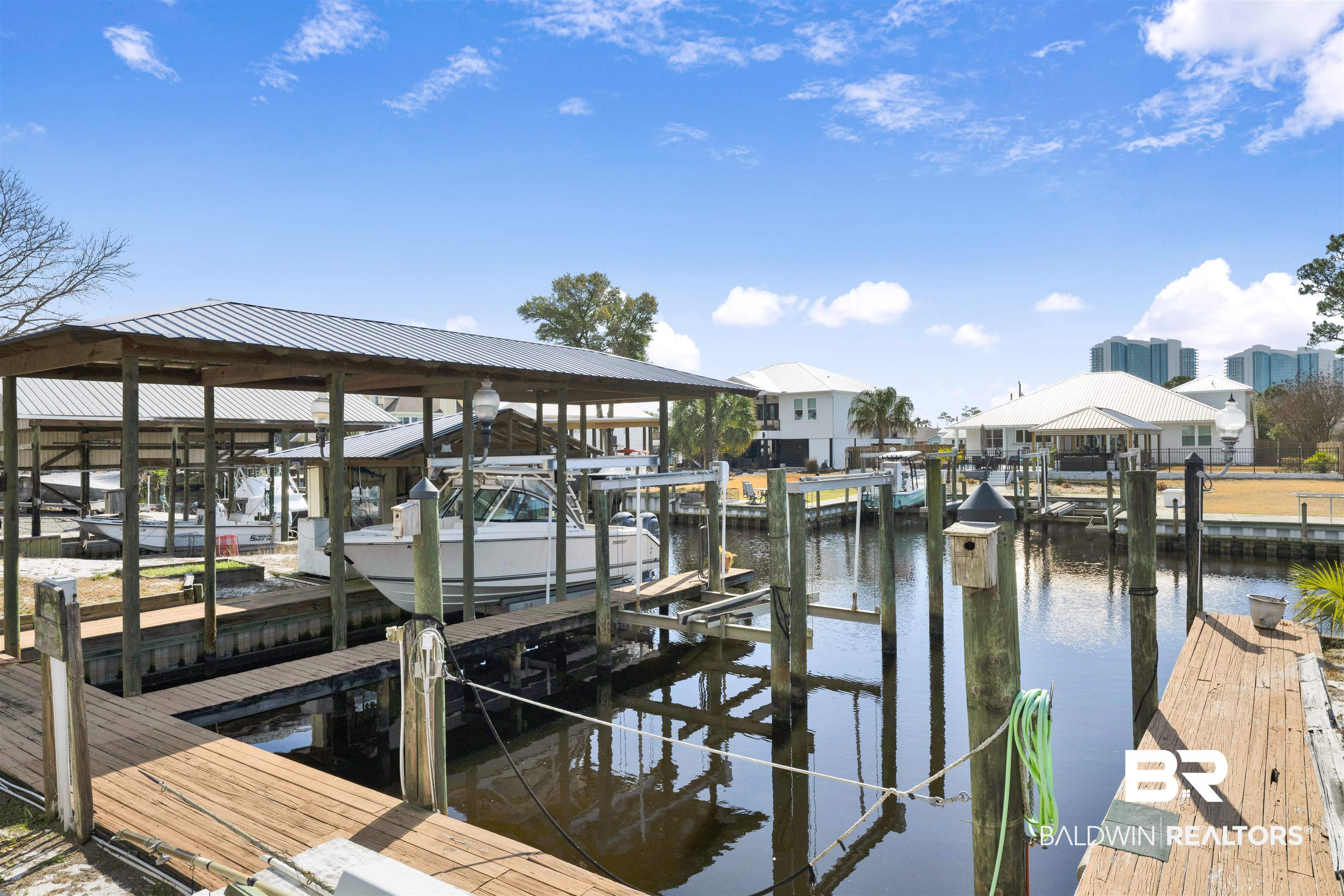 26222 Marina Road Orange Beach, AL 36561 - Photo 9 of 38 Dock with boat lift and a water view