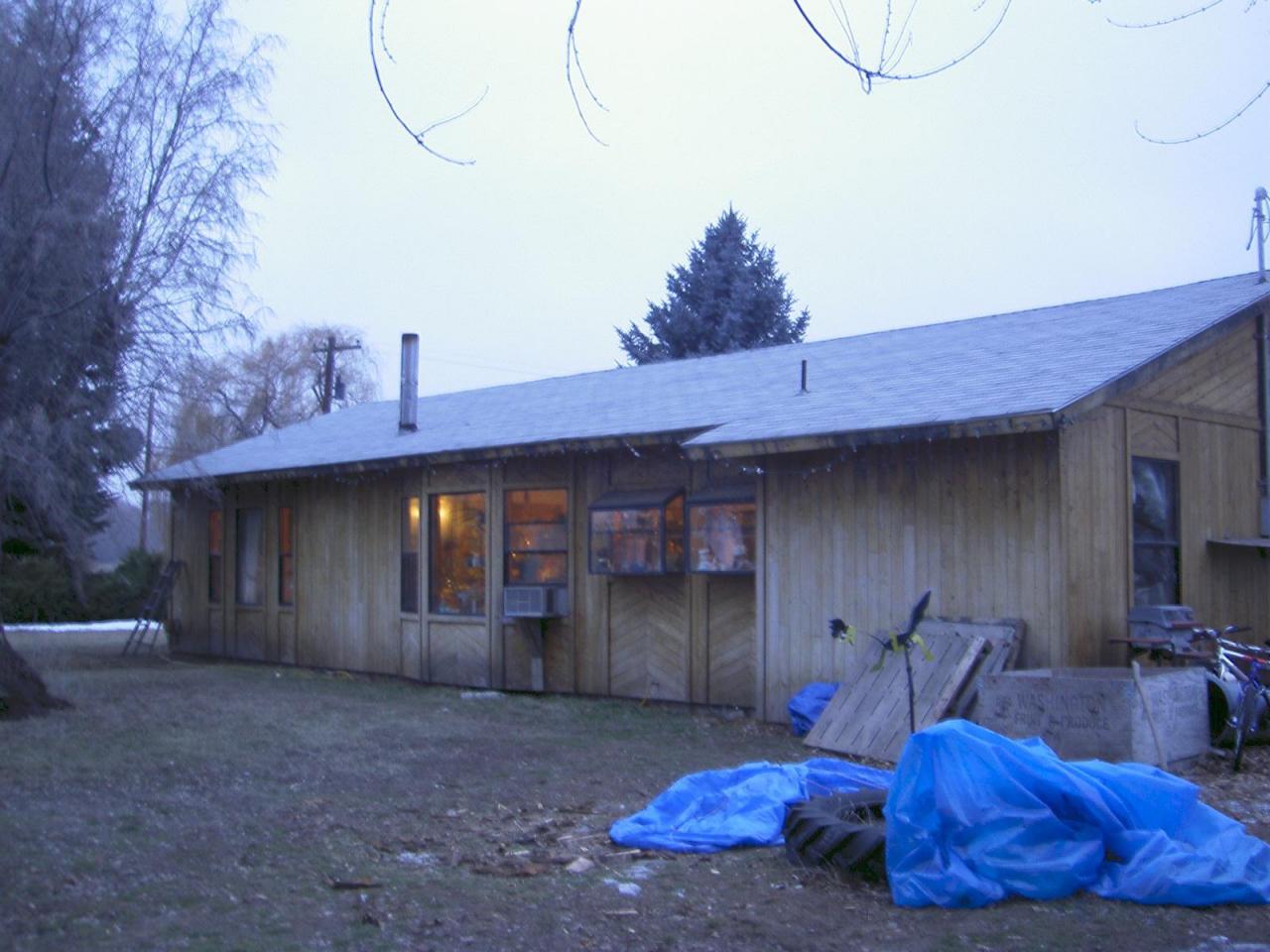 11801 Gilbert Road Yakima, WA 98903 - Photo 2 of 2 a view of a backyard with a large tree and wooden fence