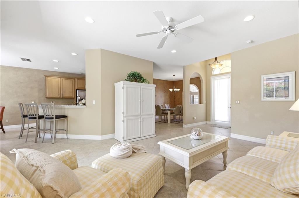 3951 Ruxton Road Naples, FL 34116 - Photo 11 of 35 a living room with furniture and kitchen view
