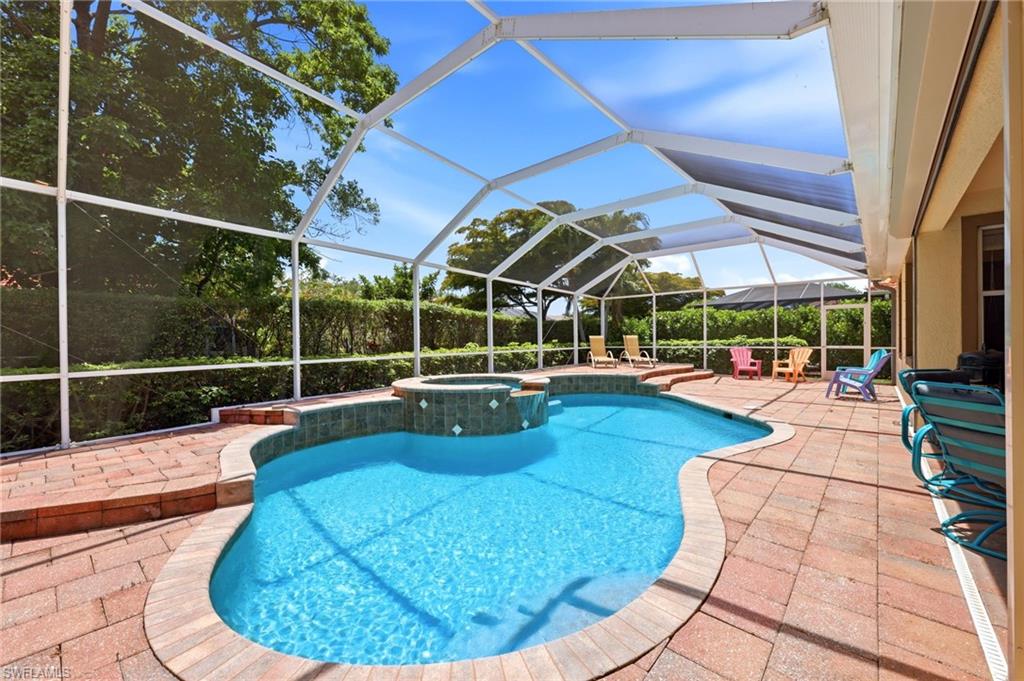 3951 Ruxton Road Naples, FL 34116 - Photo 12 of 35 a view of a swimming pool with sitting area