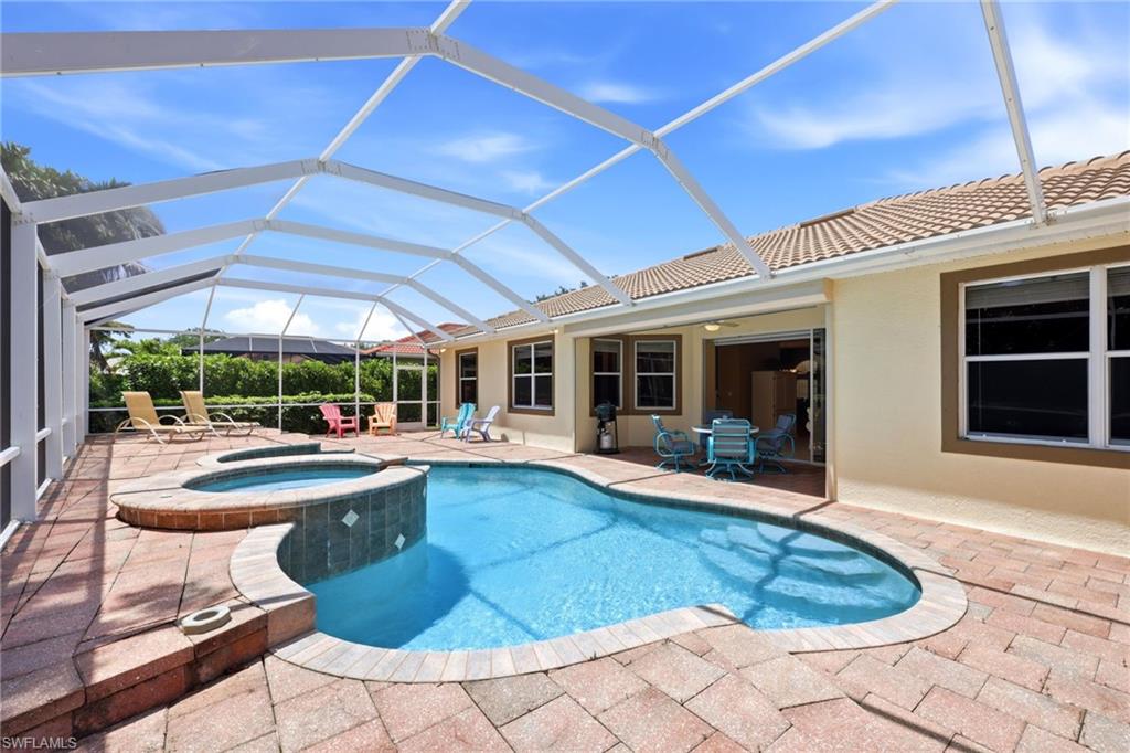 3951 Ruxton Road Naples, FL 34116 - Photo 13 of 35 a view of a house with swimming pool and sitting area