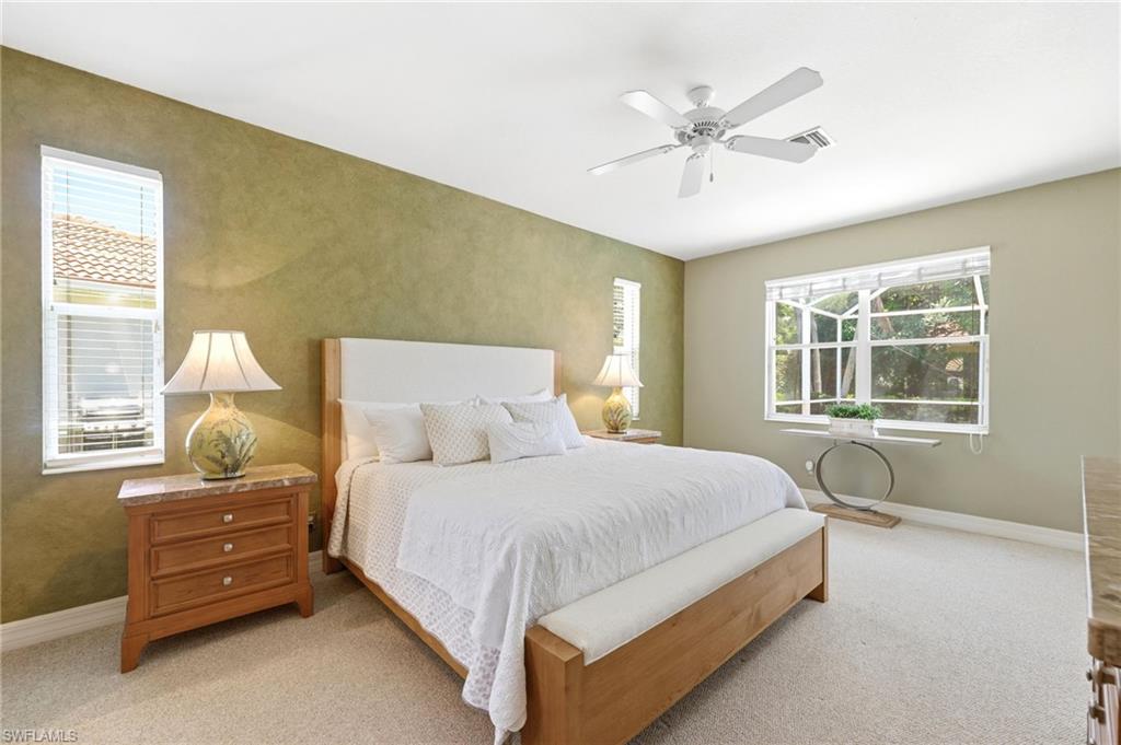 3951 Ruxton Road Naples, FL 34116 - Photo 14 of 35 a bedroom with a bed and window