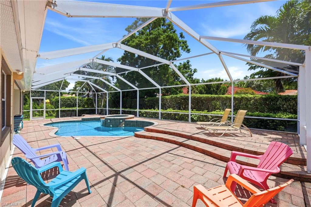 3951 Ruxton Road Naples, FL 34116 - Photo 2 of 35 a view of a chairs and table in the patio
