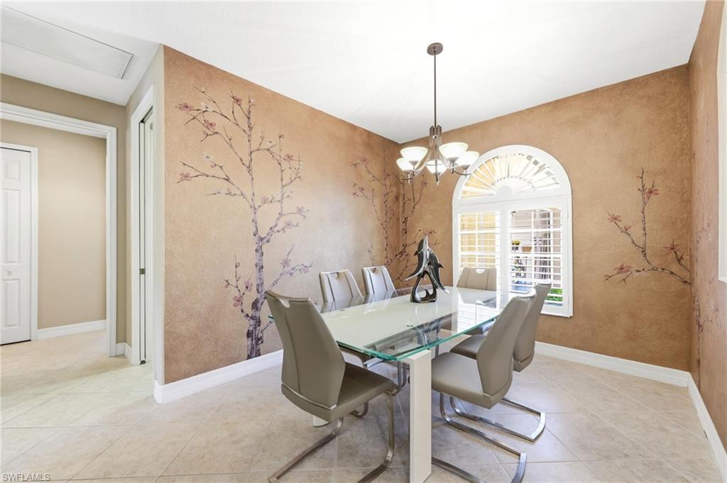 3951 Ruxton Road Naples, FL 34116 - Photo 23 of 35 a view of a dining room with furniture and window