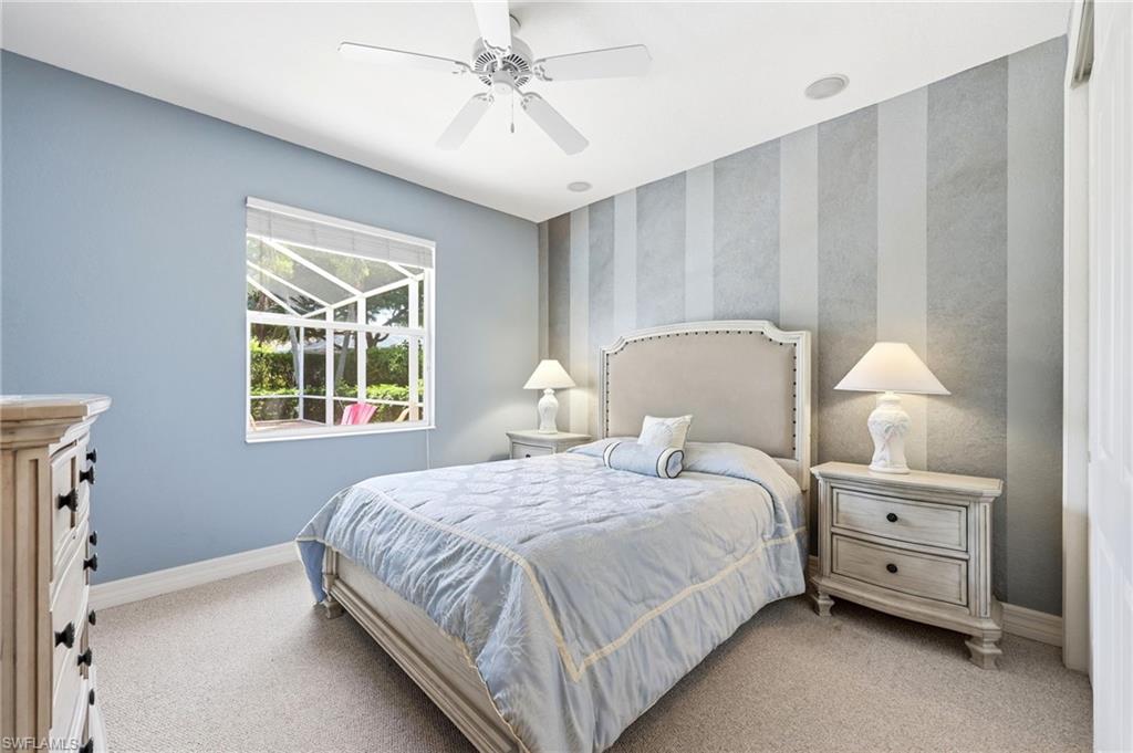 3951 Ruxton Road Naples, FL 34116 - Photo 29 of 35 a bedroom with a bed and a window