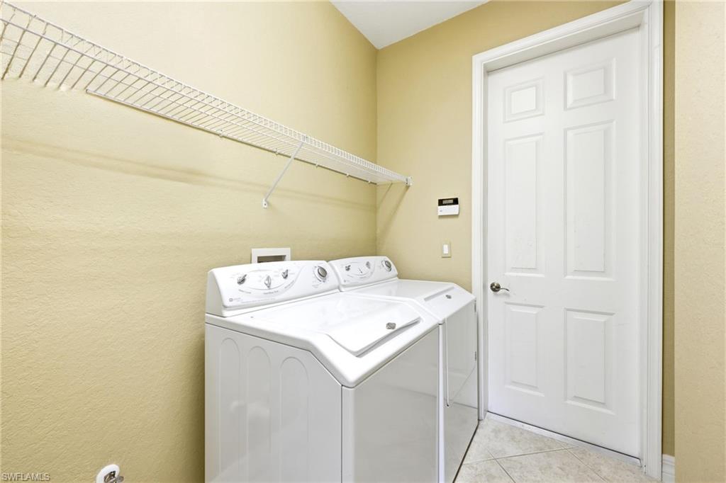 3951 Ruxton Road Naples, FL 34116 - Photo 30 of 35 a utility room with dryer and washer
