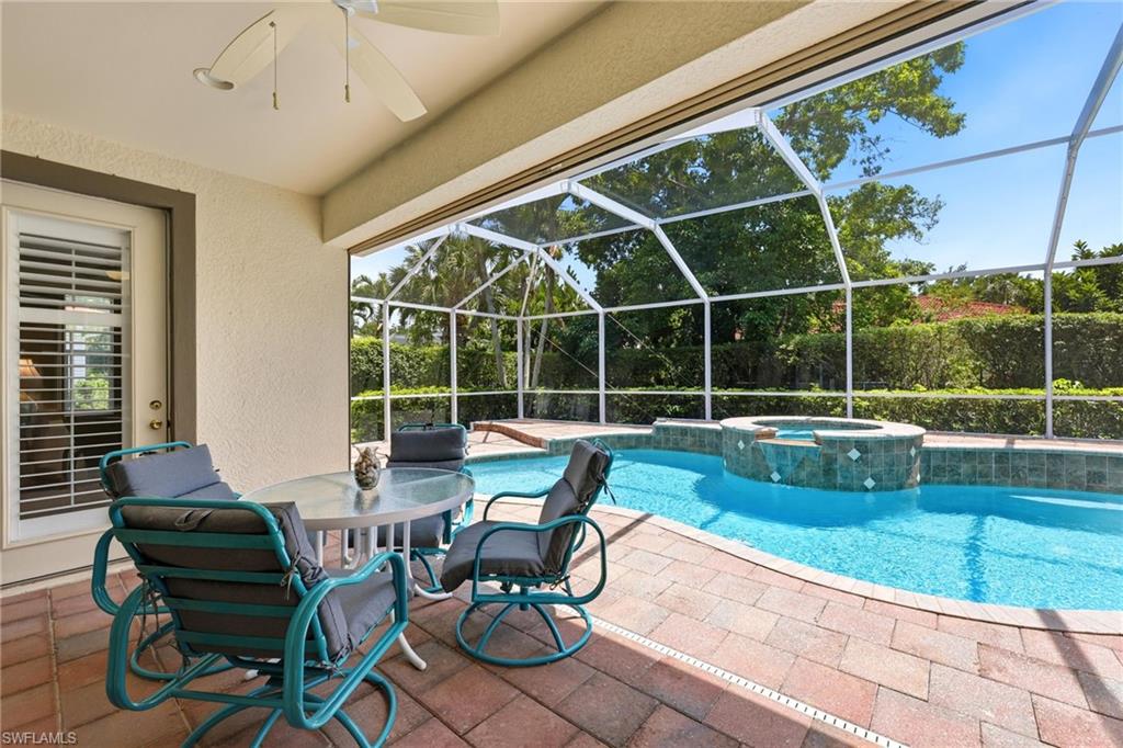 3951 Ruxton Road Naples, FL 34116 - Photo 5 of 35 a view of swimming pool with outdoor seating