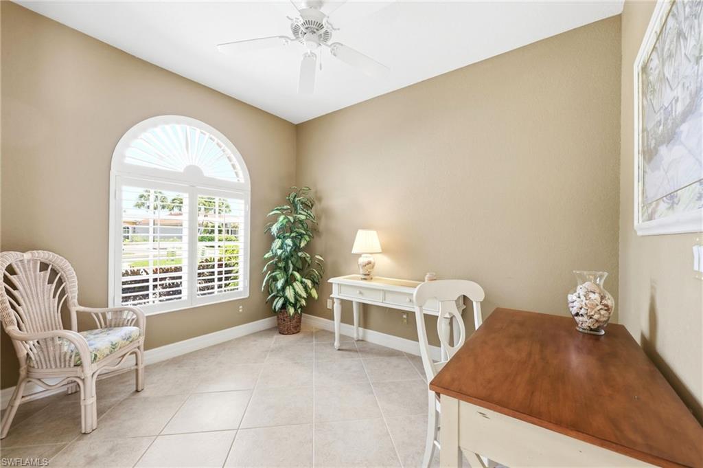 3951 Ruxton Road Naples, FL 34116 - Photo 6 of 35 a living room with furniture and a large window