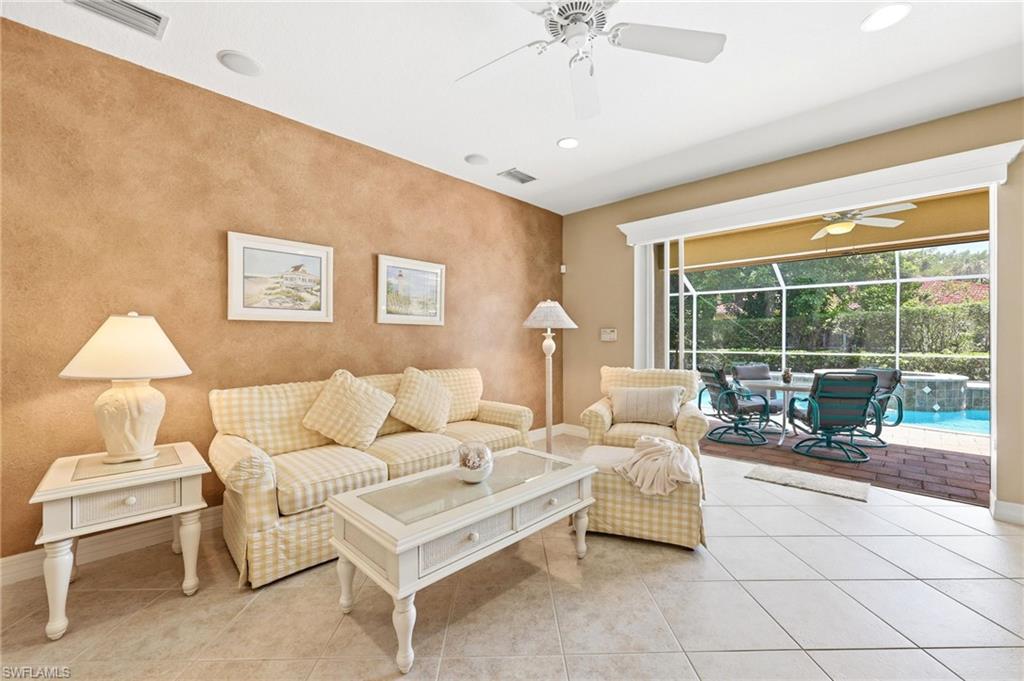 3951 Ruxton Road Naples, FL 34116 - Photo 7 of 35 a living room with furniture and a large window