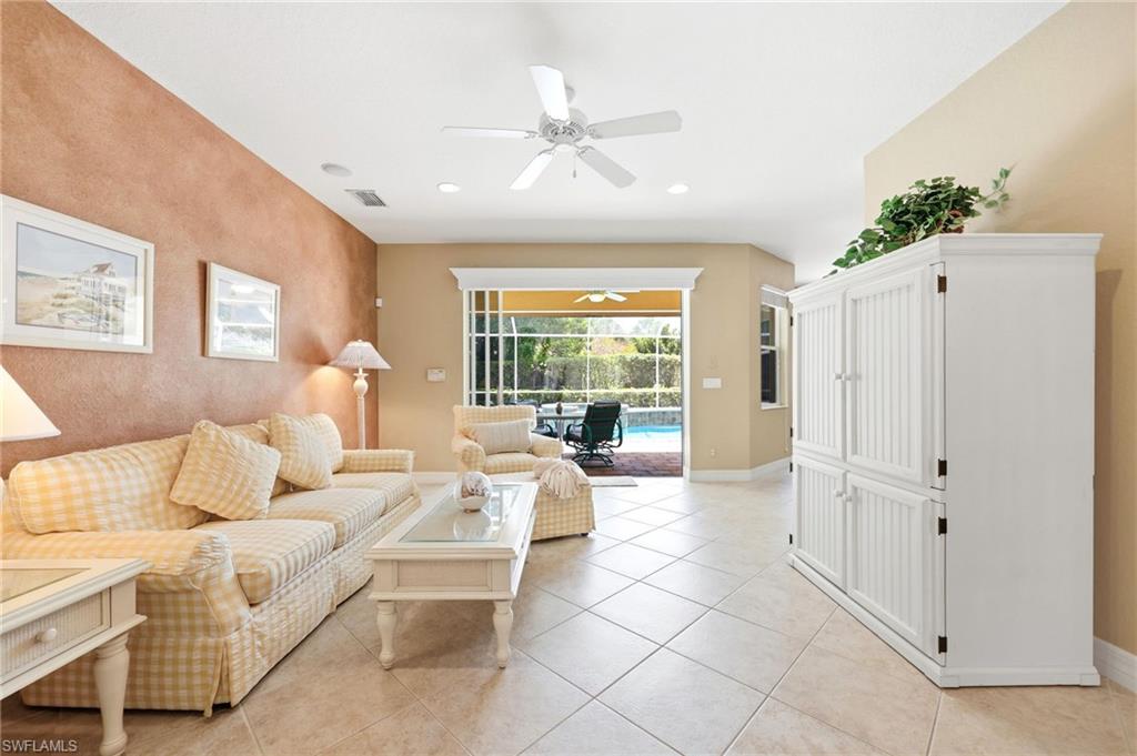 3951 Ruxton Road Naples, FL 34116 - Photo 8 of 35 a living room with furniture and a large window