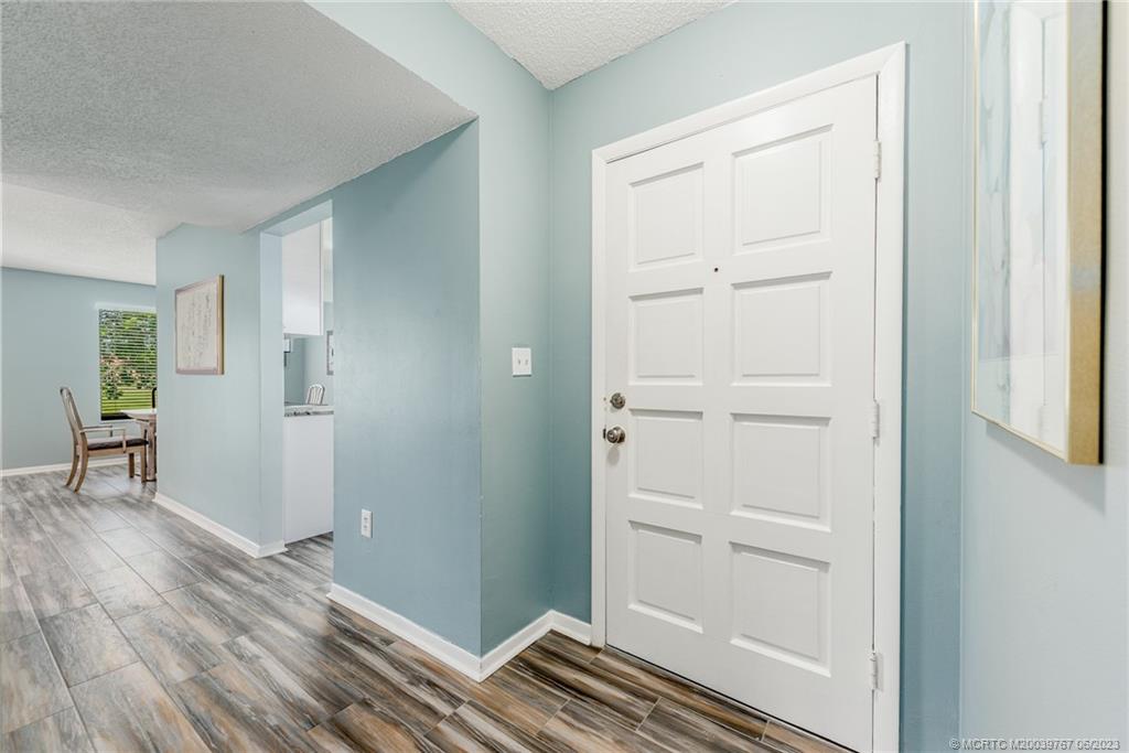 5413 Southeast Miles Grant Road, Unit G208 Stuart, FL 34997 - Photo 2 of 36 Front entry is bright and clean