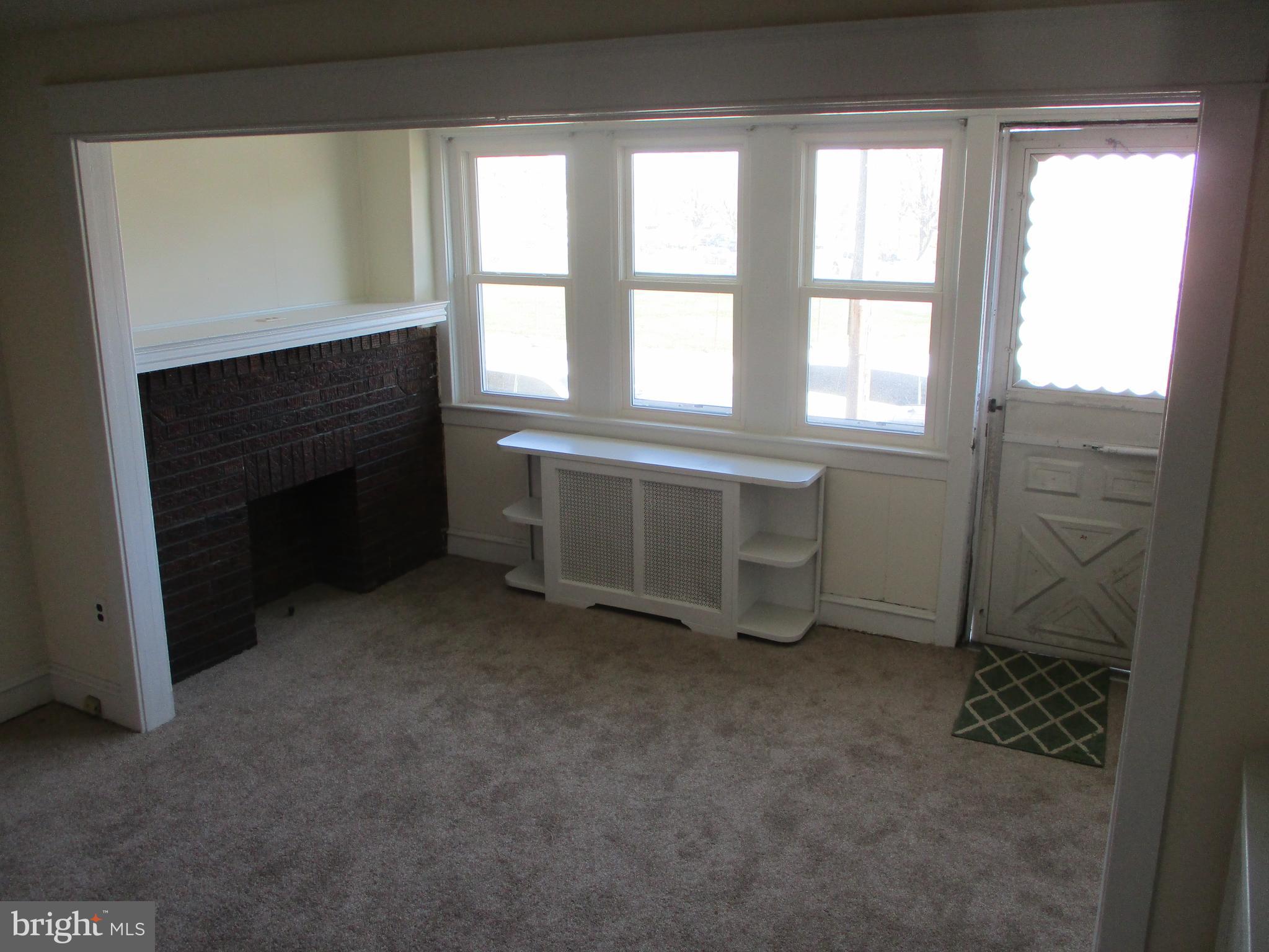 2952 Robbins Street Philadelphia, PA 19149 - Photo 7 of 19 Living room fireplace
