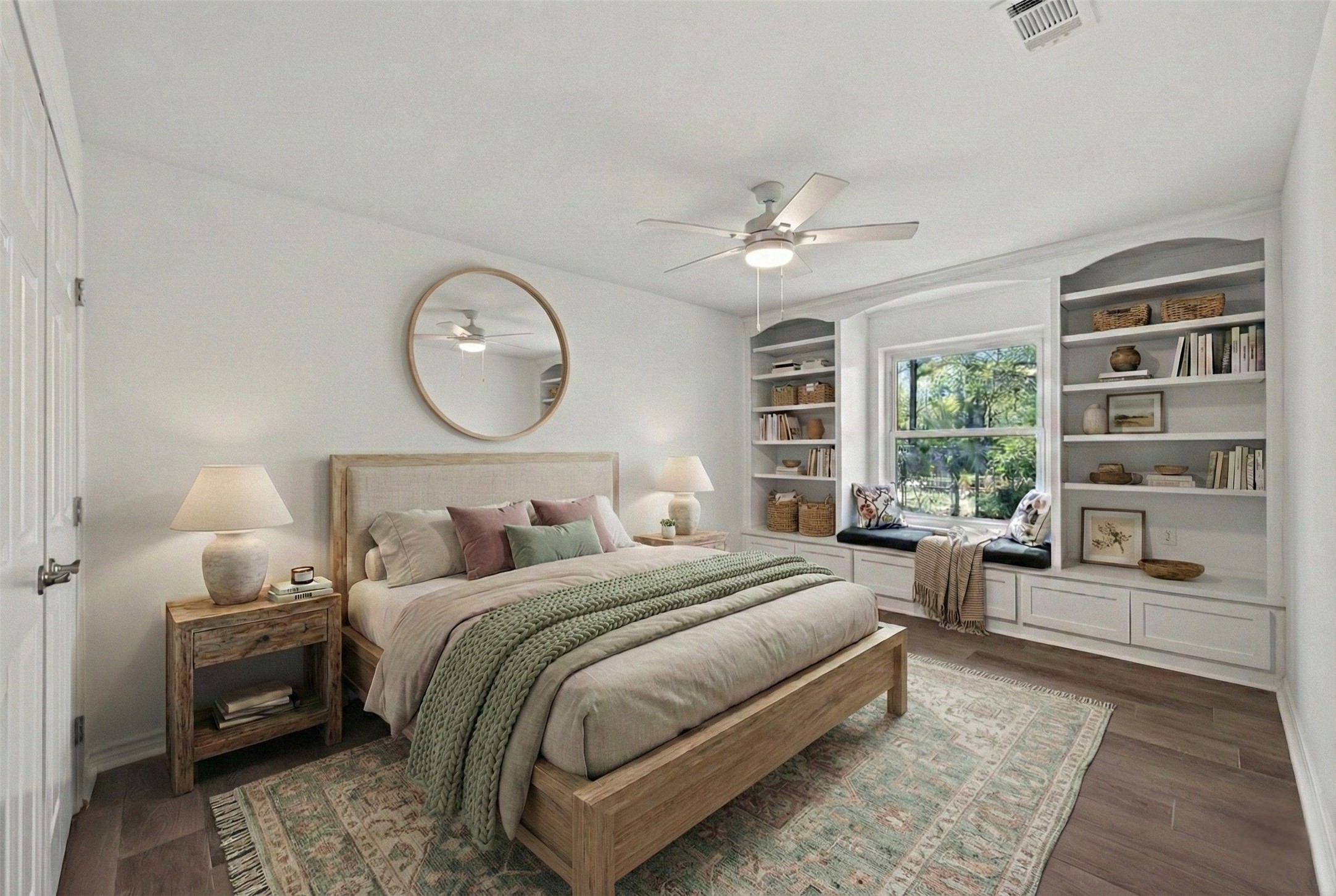 15335 Robin Trail Conroe, TX 77302 - Photo 25 of 38 Bright and spacious secondary bedroom #2, virtually staged, featuring ceiling fan, stylish wall-to-wall wood-look tile flooring, and beautiful natural light from a large window. Custom built-in shelving frames the window with an inviting built-in window seat, perfect for reading or relaxing. The generous room size provides ample space for a full bedroom suite.