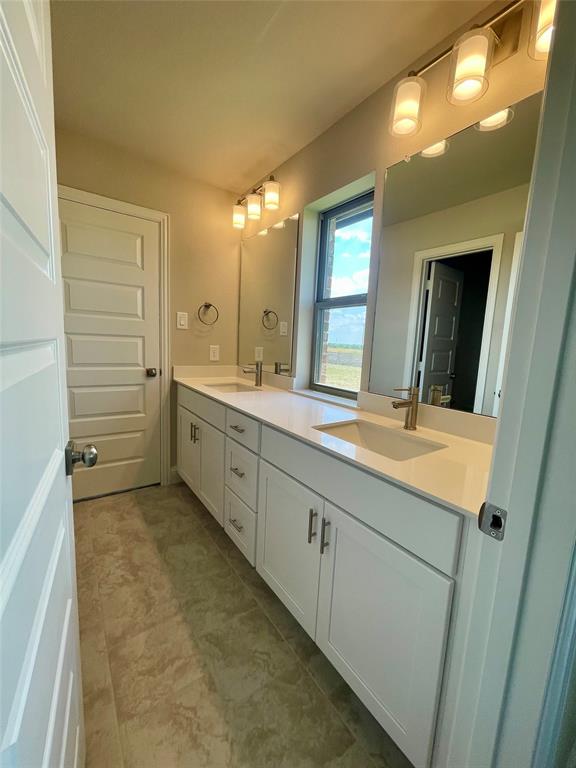 5004 Picasso Road Royse City, TX 75189 - Photo 13 of 20 a bathroom with a granite countertop sink mirror and a