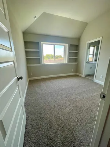 a view of room with window and hardwood floor