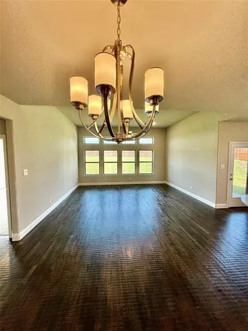 a view of a livingroom with wooden floor