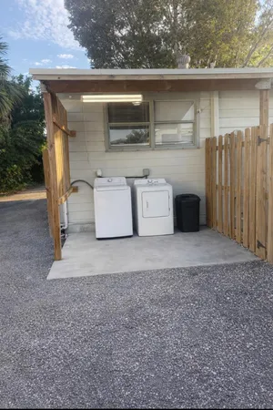 a view of a outdoor space with deck and a yard