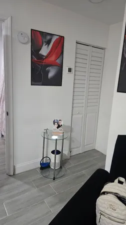 a view of a livingroom with furniture and wooden floor