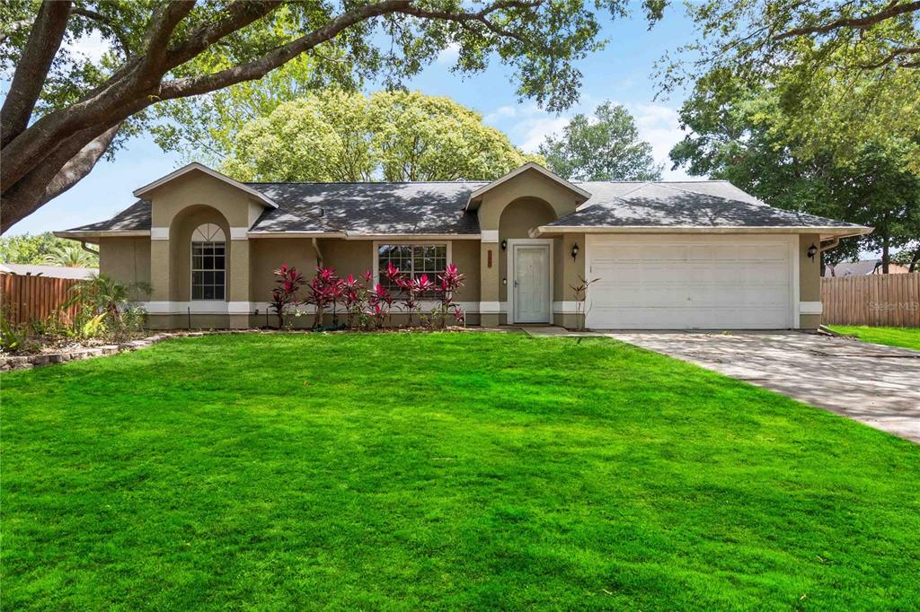 5003 Timber Ridge Trail Ocoee, FL 34761 - Photo 1 of 1 a front view of a house with garden