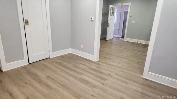 an empty room with wooden floor