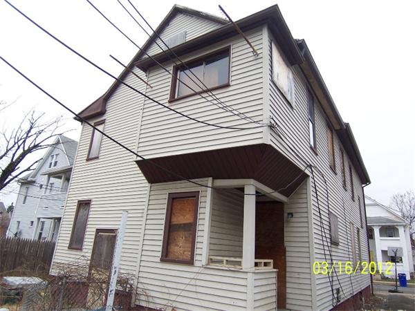 37 Johnson Street Springfield, MA 01108 - Photo 2 of 7 a view of a house with a garage