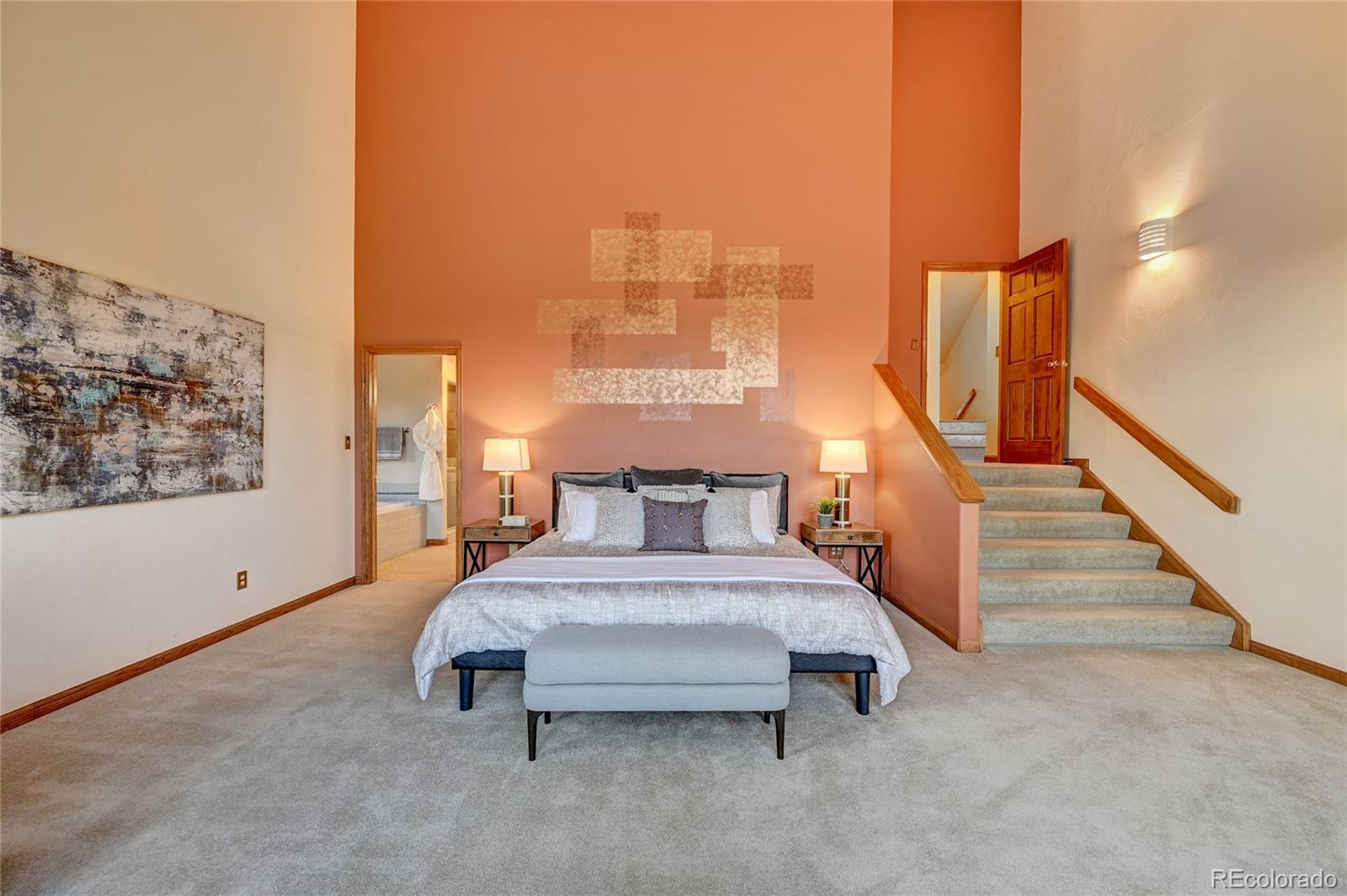 734 Spring Ranch Drive Golden, CO 80401 - Photo 18 of 40 a bedroom with a bed and window