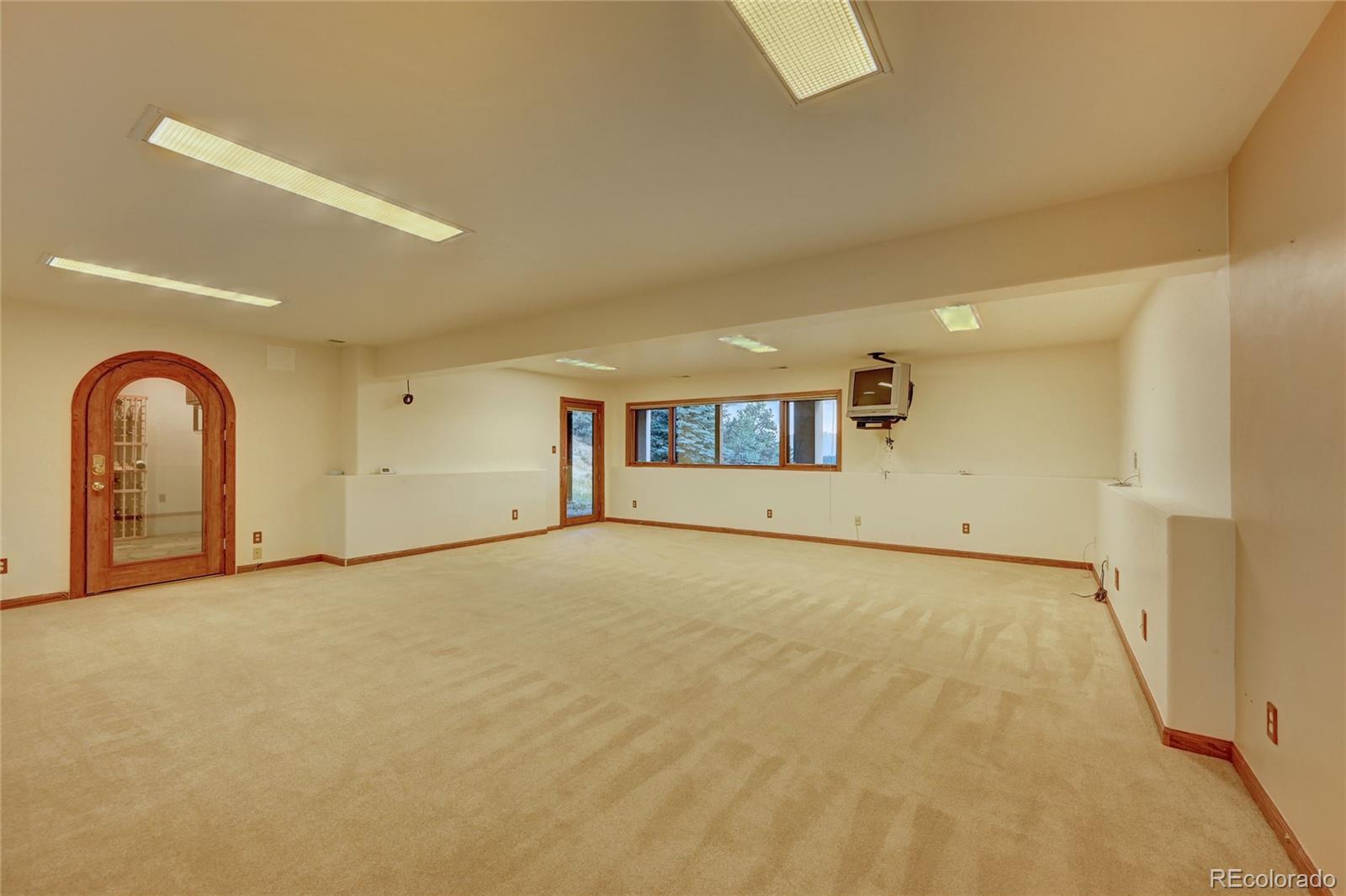 734 Spring Ranch Drive Golden, CO 80401 - Photo 28 of 40 a view of empty room with a fireplace
