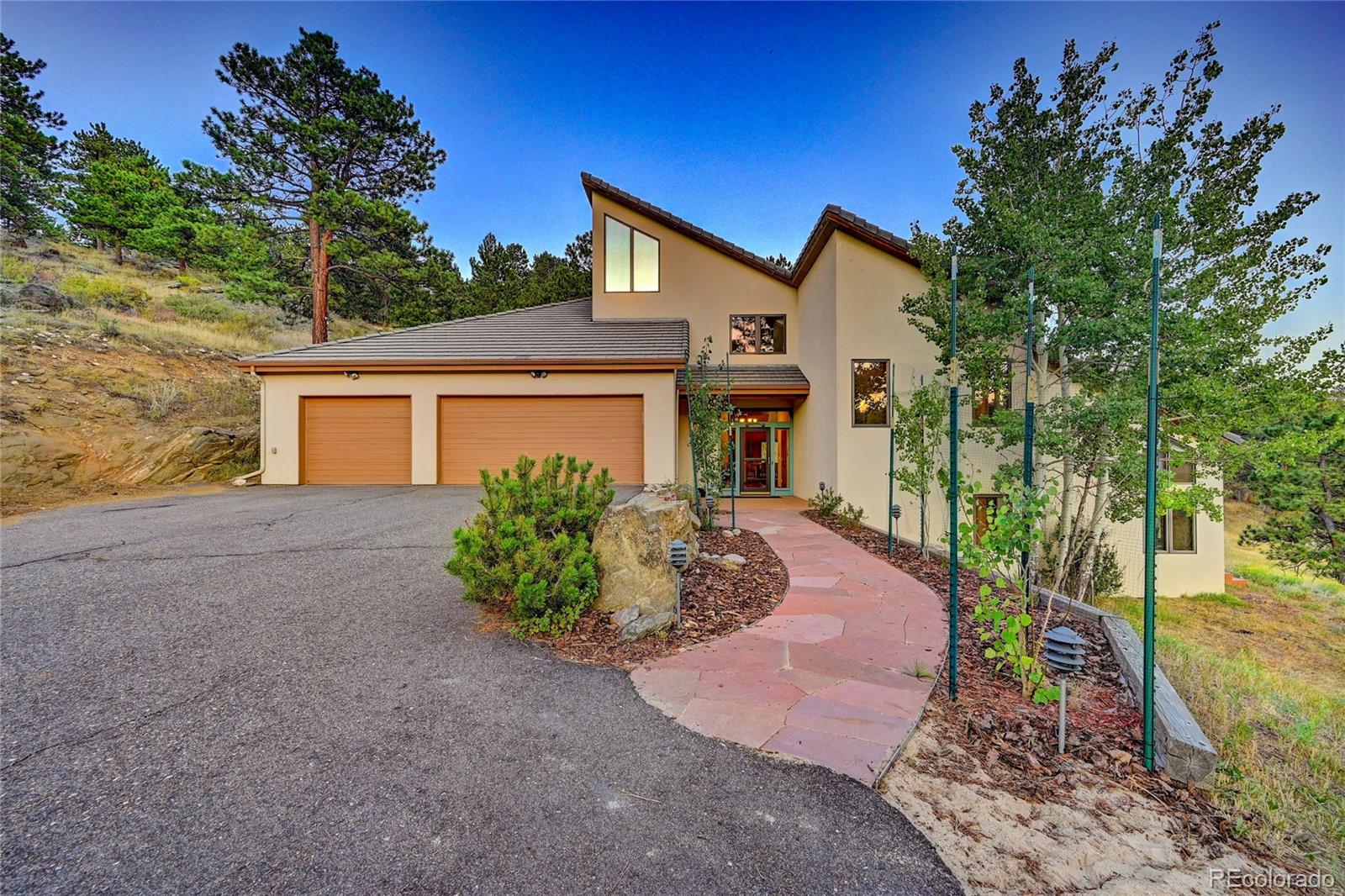 734 Spring Ranch Drive Golden, CO 80401 - Photo 30 of 40 a front view of a house with garden