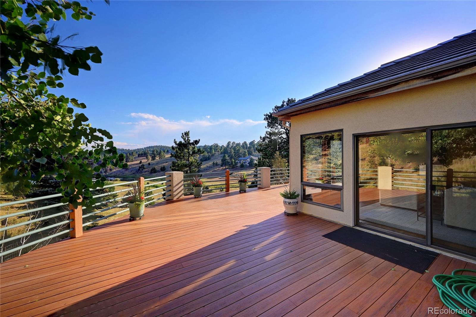 734 Spring Ranch Drive Golden, CO 80401 - Photo 3 of 40 a swimming pool with outdoor seating and yard